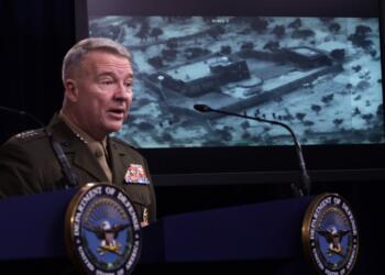 ARLINGTON, VIRGINIA - OCTOBER 30: U.S. Marine Corps Gen. Kenneth McKenzie, commander of U.S. Central Command, speaks as a picture of the operation targeting Abu Bakr al-Baghdadi is seen during a press briefing October 30, 2019 at the Pentagon in Arlington, Virginia. Gen. McKenzie and Hoffman spoke to the media to provide an update on the special operations raid that targeted former ISIS leader Abu Bakr al-Baghdadi in Idlib Province, Syria.   Alex Wong/Getty Images/AFP
