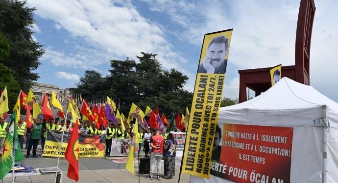 Cenevre’deki eylemde Mexmur kuşatmasına tepki