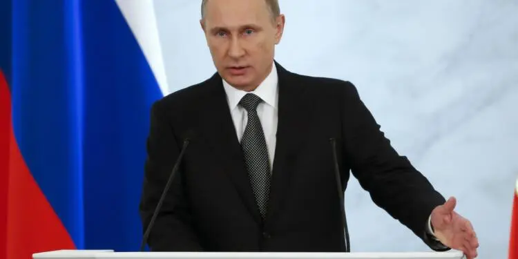 Russian President Vladimir Putin gives his annual state of the nation address in the Kremlin in Moscow, Russia, Thursday, Dec. 4, 2014. Russian President Putin has defended the Kremlin's aggressive foreign policy, saying the actions are necessary for his country's survival. (AP Photo/Pavel Golovkin)