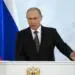 Russian President Vladimir Putin gives his annual state of the nation address in the Kremlin in Moscow, Russia, Thursday, Dec. 4, 2014. Russian President Putin has defended the Kremlin's aggressive foreign policy, saying the actions are necessary for his country's survival. (AP Photo/Pavel Golovkin)