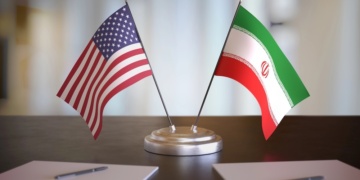 USA and Mexican flags on table. Negotiation between Mexico and United states. 3D rendered illustration.