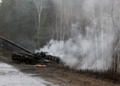 Smoke rises from a Russian tank destroyed by the Ukrainian forces on the side of a road in Lugansk region on February 26, 2022. - Russia on February 26 ordered its troops to advance in Ukraine "from all directions" as the Ukrainian capital Kyiv imposed a blanket curfew and officials reported 198 civilian deaths. (Photo by Anatolii Stepanov / AFP) (Photo by ANATOLII STEPANOV/AFP via Getty Images)