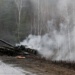 Smoke rises from a Russian tank destroyed by the Ukrainian forces on the side of a road in Lugansk region on February 26, 2022. - Russia on February 26 ordered its troops to advance in Ukraine "from all directions" as the Ukrainian capital Kyiv imposed a blanket curfew and officials reported 198 civilian deaths. (Photo by Anatolii Stepanov / AFP) (Photo by ANATOLII STEPANOV/AFP via Getty Images)